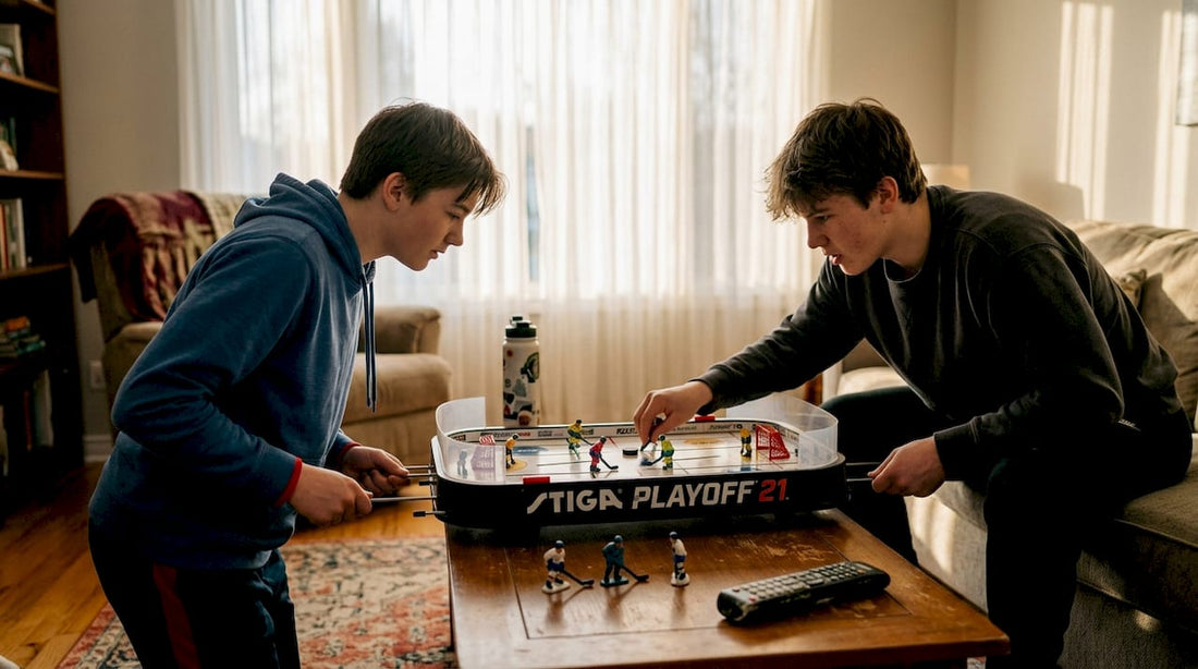 Young players competing at table hockey