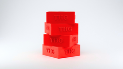 Stack of red 'THG' holders on a white background